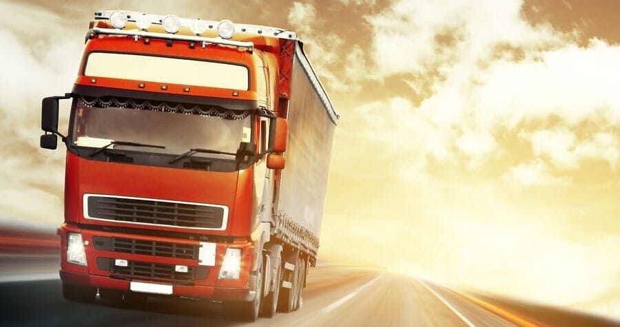 Freight truck on a road at sunset